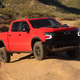 red 2023 chevy silverado zr2 parked on a berm in an off-road park